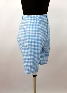 "These 1960s shorts are adorable! Made of blue and white gingham cotton, they are cool and cute! There is a back pocket with button, nylon zipper at the fly and belt loops. No labels. Excellent condition. Measurements - Waist - 25\" Hip - 36\" Length - 19\" from top of waist band Rise - 13\" from top of waist band to crotch * Proud member of the Vintage Fashion Guild * For more vintage fashions, visit Vintage Runways' shop at http://www.vintagerunway.etsy.com. Follow on Instagram - instagram.com Gingham Cotton Shorts, High-waisted Gingham Cotton Shorts, Gingham Cotton High-waisted Shorts, Preppy Gingham Shorts, Preppy Gingham Bottoms In Short Length, 60s Sportswear, Pleated Dress Short, Blue And White Gingham, Vintage Runway