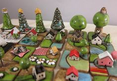 a group of small houses and trees on a table