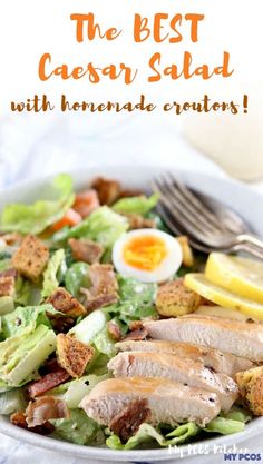 a close up of a plate of food with salad and an egg on the side