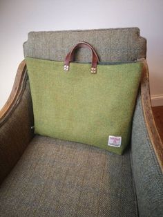 Beautifully handcrafted Harris Tweed bag with real leather handles secured with brass rivets.  Harris Tweed in stunning flecked grass green.  Fully lined with thick dark green velvet.  Measures approximately 17 by 14 inches.  Harris Tweed Orb label has been sewn on the back of the bag. Harris Tweed Bag, Tweed Bag, Embroidered Cushions, Grass Green, Harris Tweed, Leather Handles, Glasses Case, Green Velvet, Rivets