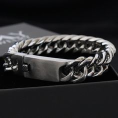 F R E E - E X P R E S S - S H I P P I N G - W O R L D W I L E Introducing our Extra Thick Men's Curb Bracelet, a bold and stylish accessory designed to make a statement. This high-quality bracelet features an impressive width of 16mm (0.63 inches) and a length of 21.5cm (8.46 inches), crafted from durable stainless steel that can withstand everyday wear and tear. The bracelet includes a special clasp that allows for easy opening and closing without assistance. Width: 16mm (0.63 inches) Length: 2 Durable Metal Bracelet For Gift, Silver Rectangular Jewelry With Stainless Steel Clasp, Durable Classic Stainless Steel Jewelry, Modern Silver Durable Jewelry, Classic Metal Cuban Link Bracelet As Gift, Stainless Steel Double Band Bracelet For Gift, Adjustable Durable Silver Bracelet, Modern Durable Silver Bracelets, Classic Stainless Steel Bracelets In Gunmetal