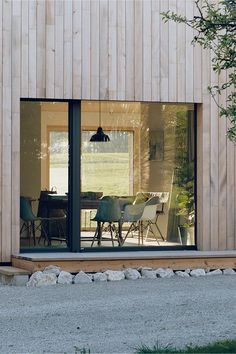 a table and chairs are sitting in front of a sliding glass door