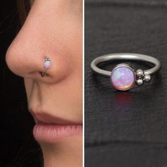 a woman's nose and nose ring with an opal in the middle