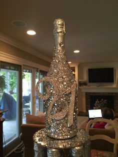 a glass bottle sitting on top of a table