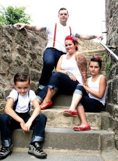 a group of people sitting on steps next to each other