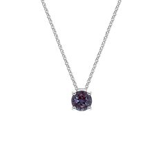 a necklace with a purple stone in the center on a silver chain and a white background