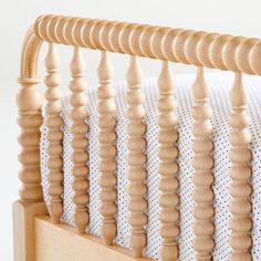 a close up of a wooden bed frame