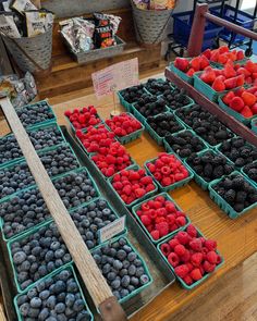 fresh berries and strawberries for sale at a market