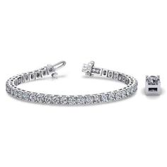 An elegant tennis bracelet featuring round brilliant diamonds set in a classic 4-prong design. Comes with an appraisal and a complimentary cleaning kit. Also available in 18K and Platinum. Item Information Metal: 14k Gold Bracelet Length: 7" Diamond Information Clarity: SI1-SI2 Color: F-G Luxury Platinum Tennis Bracelet In Diamond White, Luxury Round Tennis Bracelet Fine Jewelry, Luxury Platinum Fine Jewelry Tennis Bracelet, Luxury Fine Jewelry Bracelets In Diamond White, Luxury Classic Tennis Bracelet In Diamond White, Luxury Classic Diamond White Tennis Bracelet, Platinum Luxury Tennis Bracelet, Luxury Sparkling White Gold Diamond Bracelet, Luxury White Platinum Tennis Bracelet