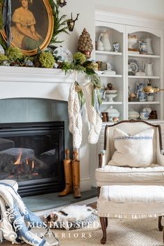 a living room filled with furniture and a fire place in front of a painting on the wall