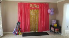 a room decorated with balloons, streamers and decorations for a birthday or baby shower