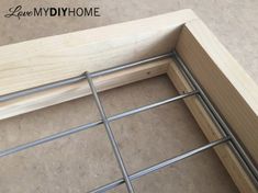 the bottom part of a bed frame is made out of plywood and metal bars