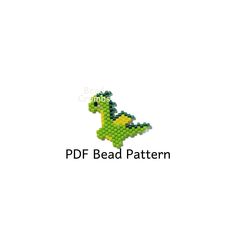 a green and yellow bead pattern with the shape of a dinosaur on it's back