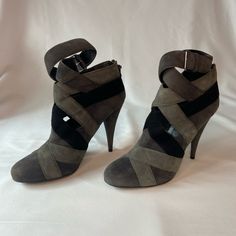 These Charcoal Grey, Grey, And Black Miu Miu Suede Goatskin Booties Have Been Worn A Couple Times But Are Still In Very Good Condition. They Have Cutout Details On The Ankles, And The Heel Is 4.5 Inches. The Ankle Straps Are Also Adjustable. One Of The Leather Details On The Zipper Is Sadly Missing, But The Zippers Work Fine On Both Boots. Note: No Returns, And All Communications And Purchases Will Be Through Poshmark. Thank You! Gray Round Toe Heels Medium Width, Gray Round Toe Medium Width Heels, Gray Closed Toe Heels For Fall, Gray Medium Width Round Toe Heels, Chic Gray Closed Toe Heels, Miu Miu Black Heels With Heel Strap, Gray Ankle Strap Heels For Evening, Chic Gray Ankle Strap Heels, Gray Leather Heels With Medium Width