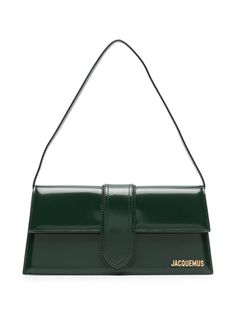 dark green calf leather smooth grain gold-tone logo lettering rectangle shape foldover top with magnetic fastening single shoulder strap main compartment internal logo patch internal slip pocket cotton lining gold-tone hardware This piece comes complete with a protective dust bag. Green Luxury Bag, Green Designer Bag, Dark Green Purse, Green Bag Outfit, Jacquemus Le Bambino Long, Jacquemus Bags, Green Shoulder Bag, Jacquemus Bag, Expensive Bag