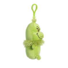 a green stuffed animal hanging from a hook