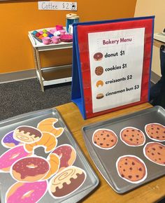 there are two trays with cookies on them and a sign that says bakery menu