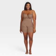 Talk about three for one! This open-bust bodysuit uses breathable, comfortable compression to tone the tummy and hips, and give you a perky rear view. Best of all? The full-coverage design is made from soft, cling-free fabric for additional comfort and is also seamless for invisible layering under your clothes. Swimwear Shoot, Rompers Online, Tummy Tucks, Under Dress, Cute Swimsuits, Women's Shapewear, Free Fabric, Shapewear, All In One