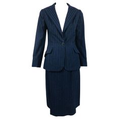 Vintage Maggy Rouff Couture pin stripe wool skirt suit in military blue and grey, from the early 1950s. Single breasted jacket closes with a single button at the waist, notched lapels, angled hip flap working pockets, darted bust, fitted waist and padded shoulders. The jacket is lined in cream silk. The matching skirt has a fitted gros grain waist band, hip darts, front angled flange pockets, inverted pleats form front center panel, the back has hip darts with a center back seam and center hem k Tailored Lined Skirt Suit For Workwear, Pin Stripe Skirt, Maggy Rouff, Pink Silk Dress, Christian Dior Haute Couture, Wardrobe Planning, Silk Dress Long, One Shoulder Gown, 1980s Dresses