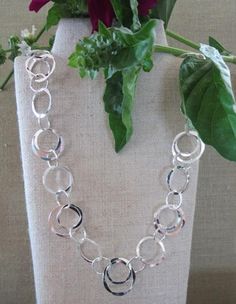 "A beautiful heavier weight bracelet with hand forged circles. Circles are 1/4'' 3/8'', 1/2'', 5/8'' with 10mm lobster clasp. 7 1/2'' Also available in a necklace in different lengths. Available in Sterling Silver,14Kt Gold Filled and Mixed Metal. Other lengths available adding $5.00 to the price for each additional inch over standard 18\" Wisteria jewelry comes in a beautiful purple gift box. Wisteria jewelry is made in Northern California. wisteriaearrings.com" Jewelry Website Design, Hand Forged Jewelry, Double Circle Necklace, Circles Necklace, Metalsmithing Jewelry, Circle Bracelet, Jewelry Website, Neck Jewellery, Gold Bracelets