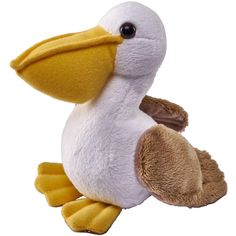 a stuffed pelican is sitting on the ground