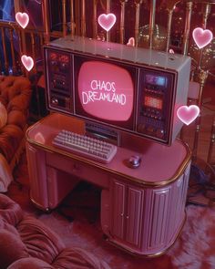 a pink computer desk with hearts on it and the words chaos dramland written on the screen