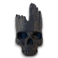 a wooden skull head with blue eyes on a white background and the image appears to be made out of wood