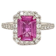 One of a Kind GIA 1.75 ct Certified Emerald Cut Natural Purplish Pink Sapphire Ring is Hand-Made in 18 kt white gold and features 32 brilliant-cut diamonds halo designs totaling 0.49 cts. "Pretty in Pink" is the theme of this Ring. This Beautiful Cotton Candy Pink Color is Stunning in this Diamond Halo design. This GIA Certified No Heat Purplish - Pink Sapphire Certificate #5212914007 Stones certificate of authenticity 1.75 cts Emerald Cut. 8.40 x 6.23 x 3.13 mm Geographic Origin is Madagascar 32 Brilliant Cut Diamonds equal 0.42 cts t.w. F - G in Color VS - Si in Clarity. Very good make and polish. 4.2 grams in Gold Weight and it has a Finger Size of 6.5 Pink Sapphire Diamond Ring, Sapphire Rings, Pink Sapphire Ring, Pink Cotton Candy, Antique Pink, Color Rosa, Sapphire Diamond, Jewelry Rings Engagement, Bridal Rings