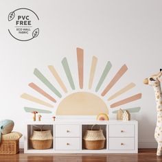 a toy giraffe standing next to a white dresser with baskets on top of it