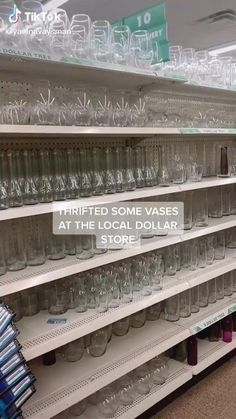 there are many empty glasses on the shelves in this store, and one is labeled'tried some vases at the local store '