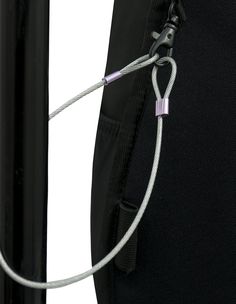 the back end of a black backpack with a white cord attached to it and an orange handle