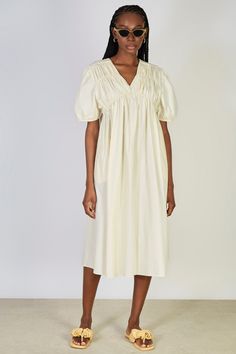 Ivory ruched seam V neck dress V-neck Dress With Ruched Bodice For Daywear, Feminine Ruched V-neck Maxi Dress, Fitted V-neck Dress With Gathered Neckline, Feminine V-neck Midi Dress With Smocked Back, Beige Ruched V-neck Maxi Dress, Spring Mid-length Dress With Ruched Bodice, Feminine V-neck Maxi Dress With Ruched Bodice, Chic V-neck Dress With Ruched Bodice, Chic Dresses With Empire Waist And Pleated Detail