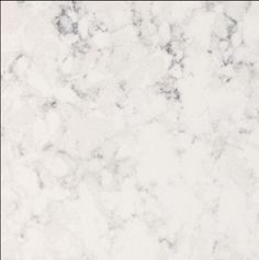 a white marble counter top with grey veiners