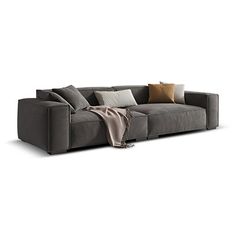 a large gray couch with pillows on it's back and the seat folded down