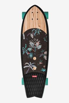 a wooden skateboard with black and green graphics on it's side, sitting upright