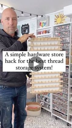 a man standing in front of a store holding up a sign that says, a simple hardware store hack for the best thread storage system