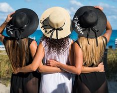 For you as a bride or for your whole squad, wear a hat that shares with the world this happy life event! A custom hat with printing for a bachelorette party is the best accessory for a customized swimsuit or a beach cover up.☆☆☆Customized BEACH HAT☆☆☆Perfect for Bachelorette, Birthday, Beach Parties and ANY EVENTS! Colors: White, Black, Coffee, Beige Our beach hats are customized with Heat Press Glitter! We can print titles, names and ANY TEXT on the hats. Please note us in message box your Cust Personalized Trendy Summer Hats, Summer Hats For Bachelorette Party, Personalized Beach Hat One Size Fits Most, Customizable Adjustable Beach Hats, Customizable Beach Hats One Size Fits Most, Customizable Adjustable Hats For Vacation, Customizable Adjustable Vacation Hats, Customizable Fun Summer Hats, Customizable Curved Brim Hat For Vacation