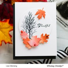 a close up of a card with leaves on it