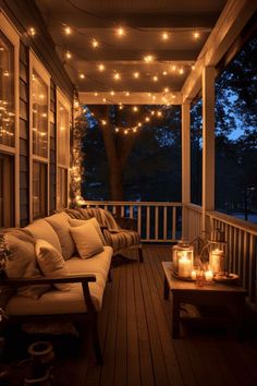 a porch covered in lots of lights and furniture