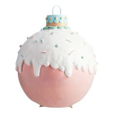 a pink and white ball ornament with sprinkles