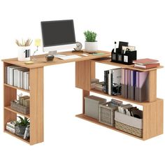 a computer desk with books and other office supplies on it, including a desktop computer