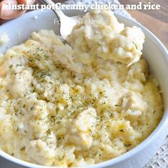 mashed potatoes in a white bowl with a spoon