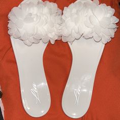 So Fun And Frou Frou!!! Big Bunch Of White Flower Petals On White Shiny Vinyl/ Jellies??!! So Cute At Beach Or Pool Or Anywhere In The Summer. Any Time Of Year At The Gym!! Look Great With A Tan And White Toenail Polish!!! Of Black Toenail Polish Would Be Cool Too!! Questions? Leave A Comment Below! White Summer Jelly Sandals For Beach Season, White Jelly Sandals For Summer Vacation, Chic Jelly Sandals For Spring Vacation, White Synthetic Jelly Sandals For Summer, White Synthetic Summer Jelly Sandals, White Toenail Polish, Black Toenail Polish, White Toenail, White Flower Petals