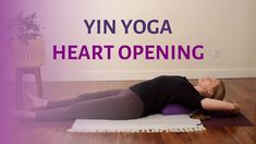 a woman is doing yoga on a mat with the words vin yoga heart opening above her