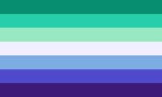 an image of a rainbow colored background with the colors blue, green, and purple