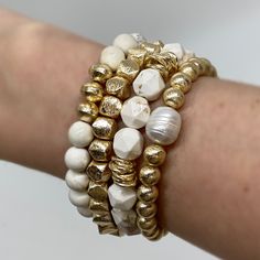 One of our Most Dazzling Stacks! This hand beaded stack set includes four bracelets: - 6mm Goddess Bracelet with a pearl accent- 10mm White Sands Bracelet with gold rings - 6mm Goddess Nugget- 8mm White Sands Bracelet with gold saucers Bracelets are “one size fits most” and are designed to fit wrists up to 7.0”. Custom sizes available upon request. Please email designsby.kb@yahoo.com once your oder is placed. *Bracelets usually ship within 3-5 business days. Stretch Beaded Bracelets Diy, Stackable Beaded Bracelets, Goddess Bracelet, Nugget Bracelet, Diy Beaded Bracelets, Beautiful Beaded Bracelet, Diy Jewelry Display, Bracelet Display, Beads Bracelet Design