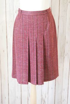 This skirt is fab - we love it's fabric. It is a basic red stripe with many varying shades of maroon to dark pink which makes it look very 3D when worn.  Across the front there are three pleats which give it movement when worn. Browse and buy https://www.etsy.com/uk/listing/230838214/vintage-1970s-maroon-striped-inverted?ref=shop_home_active_1 Vintage Cotton Mini Skirt, Inverted Pleat Skirt, Beige Vintage Cotton Skirt, Vintage Pleated Pink Skirt, Vintage Pink Cotton Skirt, Vintage Cotton Brown Skirt, Shades Of Maroon, Pleat Skirt