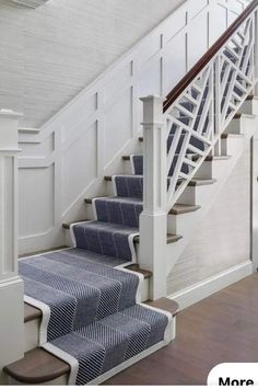 the stairs in this house are painted blue and white