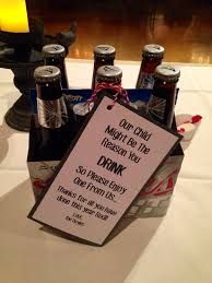 a table topped with bottles of beer and a sign