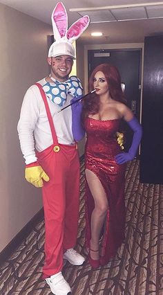 a man and woman dressed up in costumes